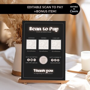 Può includere: Un cartello nero con testo bianco che dice "Scan to Pay" e include un codice QR per Google Pay, Venmo e Cash App. Il cartello dice anche "Your Business Name" e "Grazie per il supporto alla nostra piccola attività".
