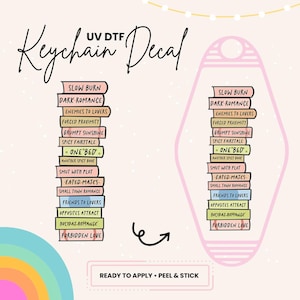 May include: A pink keychain decal with a stack of books featuring different romance novel titles. The decal is ready to apply, peel and stick.