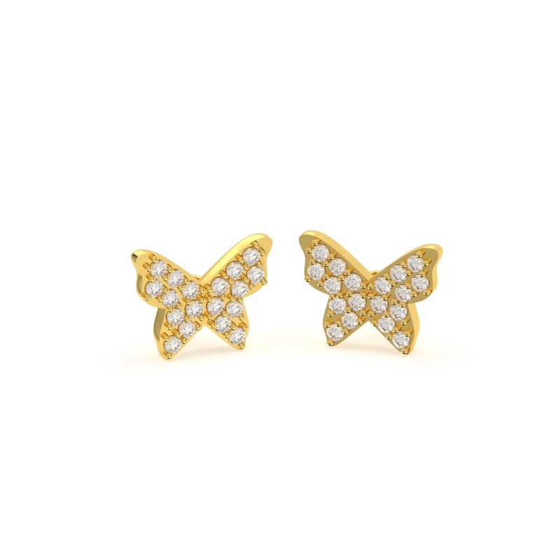 May include: A pair of gold-colored butterfly stud earrings. Each earring features a butterfly shape with a surface covered in small, clear gemstones. The earrings are set against a white background.