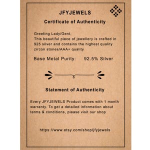 May include: A certificate of authenticity from JFYJEWELS, printed on a tan card. The text includes "Certificate of Authenticity", "92.5% Silver", and the Etsy shop URL. The card also states the jewelry is crafted with zircon stones.