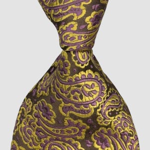 May include: A necktie featuring a dark brown base color with an intricate, repeating paisley pattern in shades of vibrant yellow and muted purple. The fabric has a subtle sheen, and the tie is knotted at the top, displaying the detailed woven design.