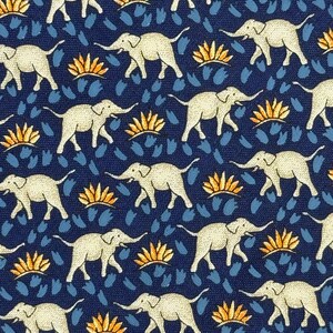 May include: A navy blue fabric featuring a repeating pattern of white elephants, orange floral shapes, and blue brushstroke-like designs. The elephants are depicted walking with raised trunks. The design is symmetrical and detailed.