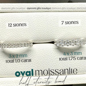 May include: Two oval moissanite half eternity bands. The band on the left has 12 stones, each measuring 3mm x 2mm, for a total of 1.0 carat. The band on the right has 7 stones, each measuring 4mm x 3mm, for a total of 1.75 carats.