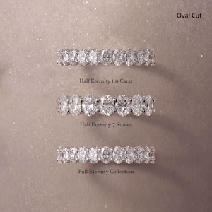 May include: Three silver-toned rings featuring oval-cut stones. The top ring is labeled Oval Cut, the middle ring is labeled Half Eternity 1.0 Carat and Half Eternity 7 Stones, and the bottom ring is labeled Full Eternity Collection.