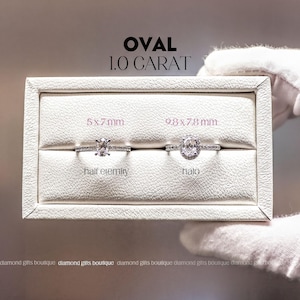 two diamond rings displayed in a white jewelry box, with text indicating the size of the rings.