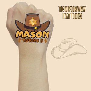 May include: Temporary tattoo sheet featuring a cartoon cowboy hat, sheriff's star, and the text "MASON TURNS 5".