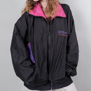 May include: Black windbreaker jacket with a pink and purple lining. The jacket has a zip closure and the text "Kappa Culture" is embroidered on the front.