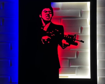 May include: A black and white silhouette of a person holding a gun, framed in a black frame with red and white lighting behind the silhouette.