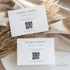 May include: Two white cards with black text that reads "Kindly Reply by April seventeenth". Each card has a black QR code and the text "www.ourwedding.com". The bottom card also has the text "Wildly Simple Studio".