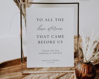 May include: A white sign in a gold frame with the text "To all the love stories that came before us. Thank you for showing us the way. Cecilia & Thomas 17.05.2025".
