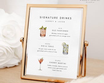May include: A gold-framed sign displays a list of signature drinks for Audrey & Jacob. The drinks include an Old Fashioned, Gin & Tonic, and Cherry Martini, with watercolor illustrations. The sign is on a white surface.
