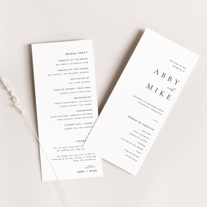 May include: A wedding ceremony order of service card with the names Abby and Mike printed in a simple, modern font. The card lists the order of the ceremony, including the welcome, reading, vows, and recessional. The date of the wedding is Saturday, September 21, 2025, in Winchester, Hampshire.
