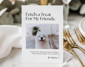 May include: White card with the text "Fetch a Treat For My Friends." and a photo of a fluffy white dog. Below the photo is the text "PLEASE TAKE A TREAT BAG FOR MY FRIENDS WHO COULDN'T MAKE IT TO THE PAWTY!" and the dog's name, "Snowy."