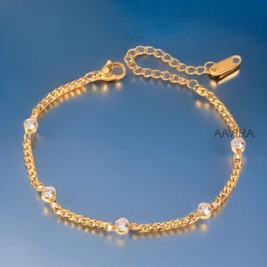 Cubic Zirconia Bezel Bracelet: 925 Sterling Silver, 14K Yellow Gold