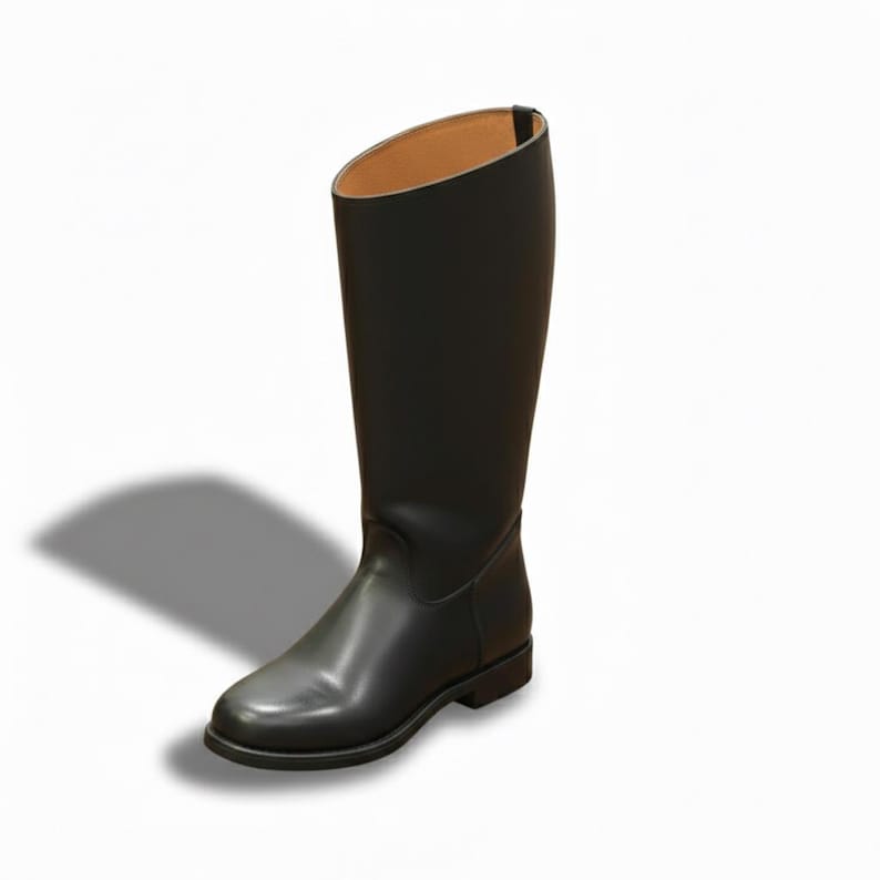 May include: A tall black leather riding boot featuring a smooth, matte finish, a rounded toe, a low block heel, and a tan interior lining. The boot has a structured, upright shaft that reaches mid-calf, with a simple, clean design and no visible closures.