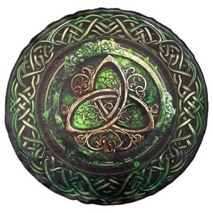 May include: A green and gold Celtic knot design with a trinity knot in the centre. The design is surrounded by a circular border of green and gold Celtic knots.