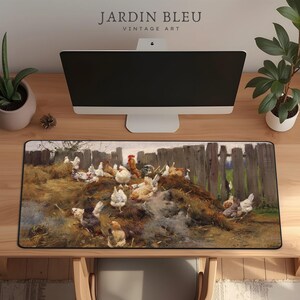 May include: A rectangular desk mat featuring a vintage painting of chickens in a farmyard setting. The artwork depicts a rooster and hens near a wooden fence. The mat has a black border and the text "JARDIN BLEU VINTAGE ART" is at the top.
