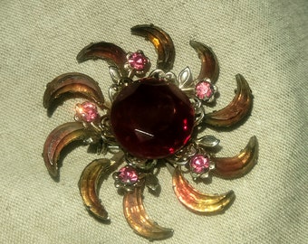 Vintage gold tone broach with multi colored stones