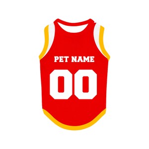 May include: Red sleeveless dog jersey with white trim and yellow accents. The jersey has the text "PET NAME" and the number "00" printed on the front.