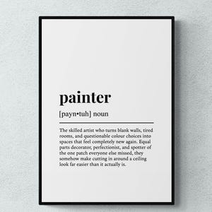 May include: A framed wall art print featuring a dictionary-style definition of the word painter. The text includes the phonetic pronunciation, the noun classification, and a descriptive paragraph about the role of a painter in black text.