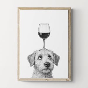 May include: A framed black and white print features a dog with a wine glass balanced on its head. The dog has a fluffy, light-colored coat and a focused expression. The wine glass is filled with red wine.