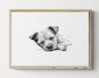 Puede incluir: Dibujo a lápiz en blanco y negro de un cachorro durmiendo, enmarcado. El perro está acostado sobre una almohada, con los ojos cerrados. La obra de arte está en un marco de madera de color claro.