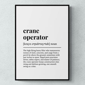 May include: Black framed print with the definition of "crane operator" in bold black text on a white background. The definition includes the phonetic pronunciation and a description of the job.