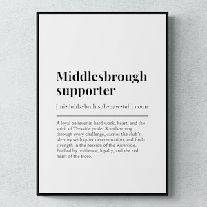 May include: A black framed print featuring the words "Middlesbrough supporter" in bold black text. The definition below describes a loyal believer in hard work and the spirit of Teesside pride. The print is on a white background.