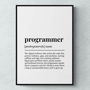 May include: A framed print featuring the word "programmer" with its pronunciation and a detailed definition. The text is black on a white background, suitable for a home office.