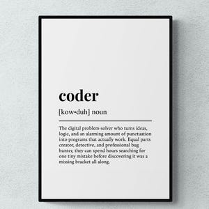 May include: A framed wall art print featuring a dictionary-style definition of the word coder. The text includes the phonetic pronunciation, the noun classification, and a descriptive paragraph about a digital problem-solver in black ink.