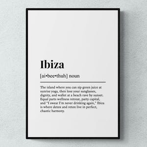 May include: A framed print with a black border featuring the word "Ibiza" in a bold font, followed by a phonetic pronunciation and a definition. The definition describes Ibiza as a place of contrasts, including wellness retreats and party scenes.