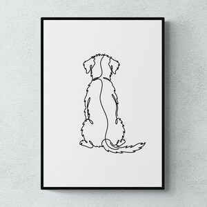 Puede incluir: Una impresión artística minimalista enmarcada que presenta un dibujo de línea continua de un perro desde la parte trasera. El arte lineal negro se establece sobre un fondo blanco, creando una estética simple pero elegante. El perro está representado en posición sentada.