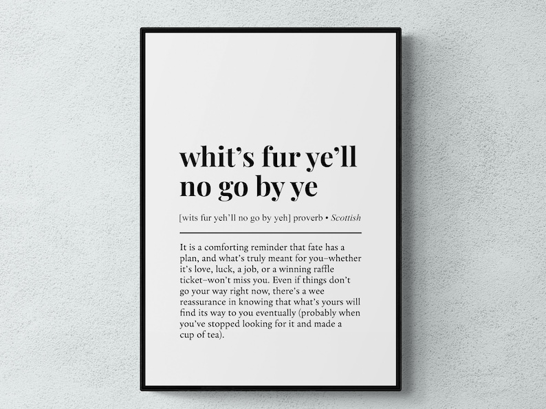 May include: Black framed print with the text "whit's fur ye'll no go by ye" in a bold, serif font. The print includes a definition and a comforting message about fate, in a Scottish proverb style.