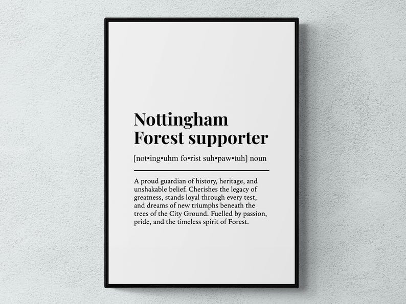 May include: A framed print with the words "Nottingham Forest supporter" in black text on a white background. The text includes a phonetic pronunciation and a definition describing the qualities of a supporter.