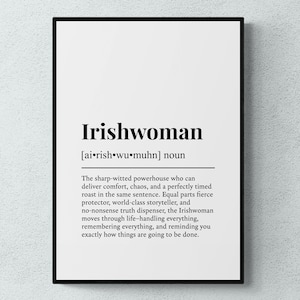 May include: A framed print with the word "Irishwoman" in bold black text, along with a definition. The definition describes an Irishwoman as a sharp-witted powerhouse who delivers comfort, chaos, and a perfectly timed roast.