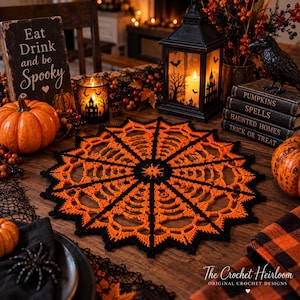 May include: A round, crocheted doily featuring a spiderweb pattern in alternating black and orange yarn. The design radiates from a central point with intricate web-like segments and a pointed, scalloped edge, creating a circular display piece.