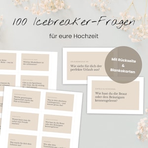 May include: A collection of cards with questions for a wedding icebreaker game. The cards are beige with black text, and the title "100 Icebreaker-Fragen" is at the top. The cards are arranged on a white surface with floral accents.