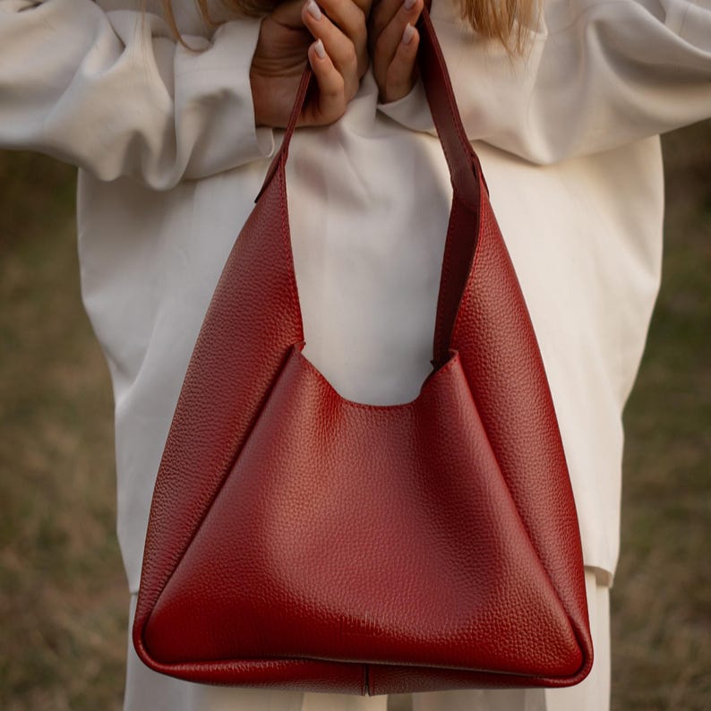Red leather hobo bag with wallet, handmade genuine leather shoulder bag for women, stylish and functional, everyday handbag with magnetic button closure and durable textured leather.
