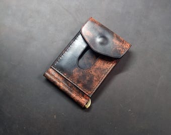 Cartera negra jaspeada con clip