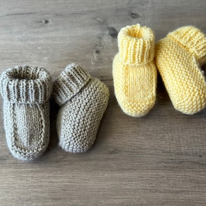 Knitted baby booties one colour