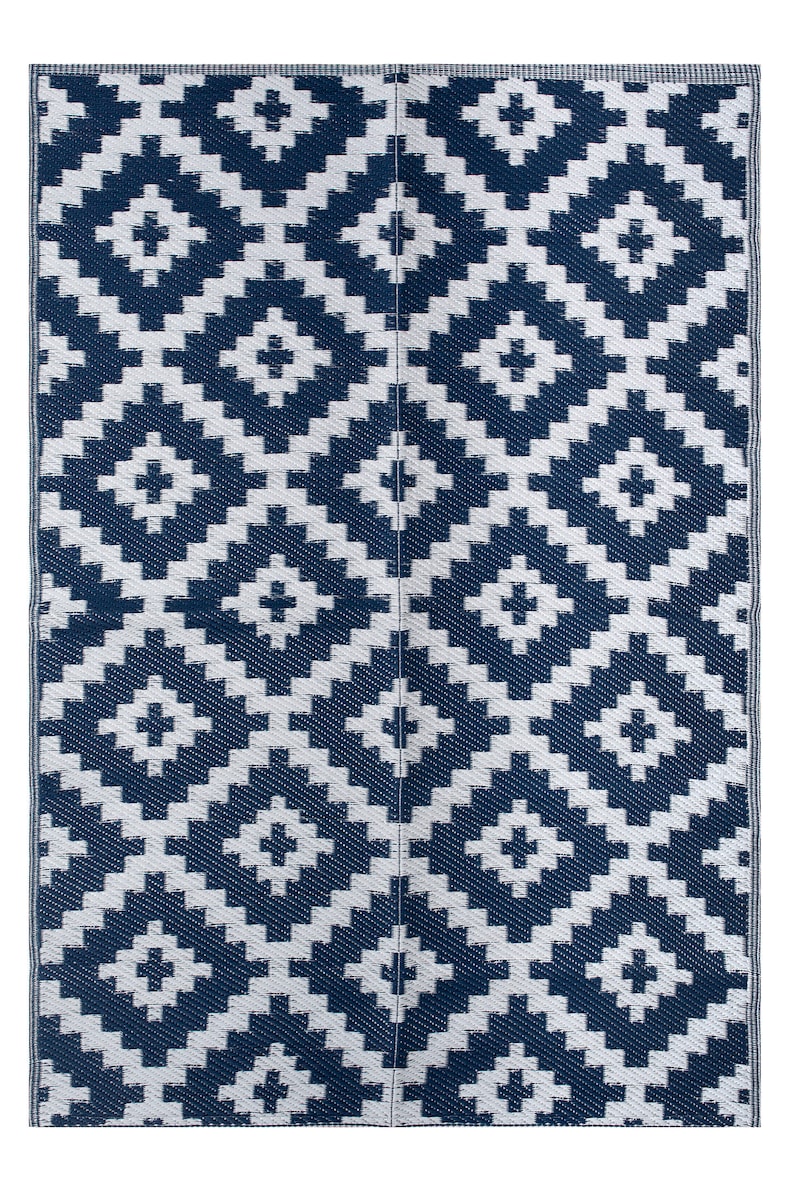 May include: A blue and white patterned picnic blanket with a geometric design. The blanket is made of woven plastic and is perfect for outdoor use.