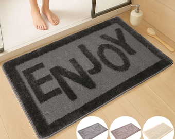 Genießen Sie die Badematte, einen ästhetischen Badteppich, ein minimalistisches Badezimmer, eine geprägte Badematte, einen Typografie-Teppich, einen getufteten waschbaren Teppich, ein niedliches Badezimmerdekor