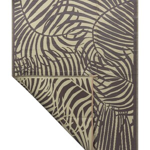 May include: A brown and beige outdoor rug with a tropical leaf pattern. The rug is made of woven plastic and has a fringed edge.