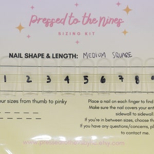 May include: A clear plastic sizing kit for press-on nails. The kit includes 12 different sizes of nails, labelled 0 through 11. The kit also includes instructions on how to measure your nails and choose the right size.