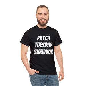 May include: A black t-shirt with white text that reads "PATCH TUESDAY SURVIVOR".