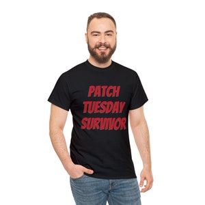 May include: A black t-shirt with the text "PATCH TUESDAY SURVIVOR" in red.