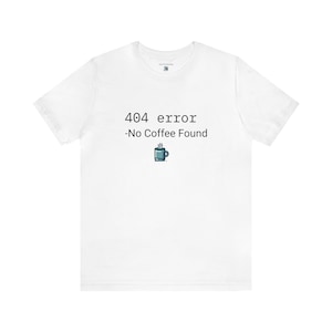 May include: White t-shirt with a black and white graphic that says "404 error -No Coffee Found" with a small cartoon coffee cup icon.