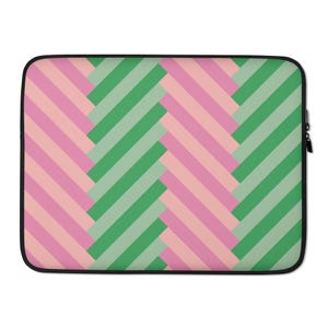 May include: A laptop sleeve with a pink and green geometric pattern. The pattern is made up of diagonal stripes that create a woven effect.