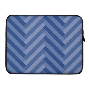 May include: A blue laptop sleeve with a geometric pattern of overlapping diagonal stripes.