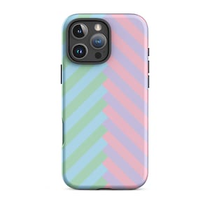 May include: A phone case with a diagonal striped pattern in shades of pink, blue, and green.